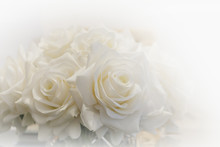 White Roses Bouquet Surrounded By White Light.
