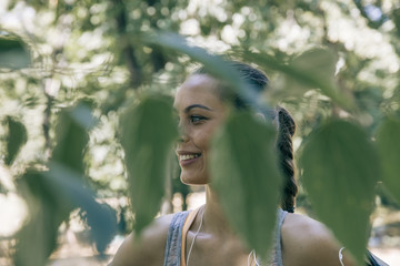 Pretty young woman having a break during exercise