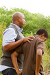 © digitalskillet1 - Father comforting his son.