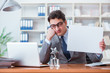 © Elnur - Businessman  in office holding a blank message board