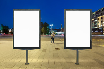 Blank street billboard at night.