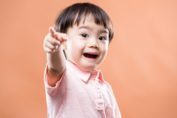 Asian baby pointing front