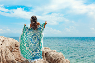 Wall Mural - beautiful young woman with naked back dancing on the beach