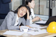© Bavorndej - Asian Woman Sleep while Meeting with team. Woman ignor for meeting with team.