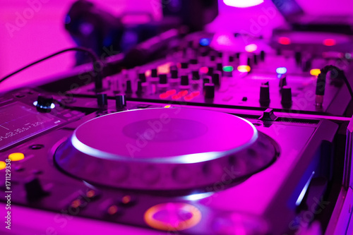 Close-up photo of pro DJ Controller in purple light Wallpaper Mural