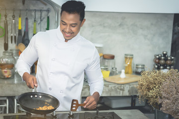 Asian chefs, cooking with a friendly smiley face