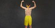 © Studio Romantic - Funny thin guy in sportswear. Back view. Comic humor concept in sports.