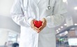 Medicine doctor holding red heart shape in hands, medical technology