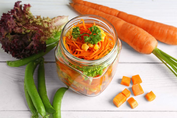 Canvas Print - Jar with delicious carrot salad on wooden table