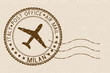 Postal stamp, round brown postmark with plane icon. Milan, Italy