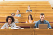 © Yakobchuk Olena - Cheerful students studying in lecture hall