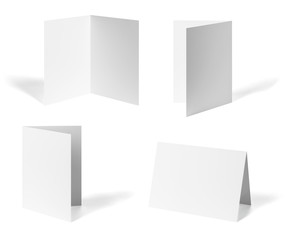 Poster - close up of a  blank folded leaflet or a desktop calendar white paper on white background 