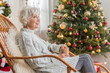 © Yakobchuk Olena - Charming senior lady is holding mug with smile