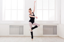 Beautiful Ballerina Stands In Ballet Pirouette