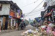 © andrii_lutsyk - Pure dirty street with trash and skyscrapers on the background in Jakarta, Indonesia