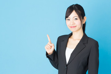 Wall Mural - portrait of asian businesswoman isolated on blue background