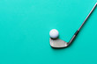golf ball and golf club on green background