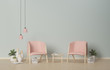© designedbyyou - Interior pink armchairs and ornamental plants on empty wall background,3D rendering
