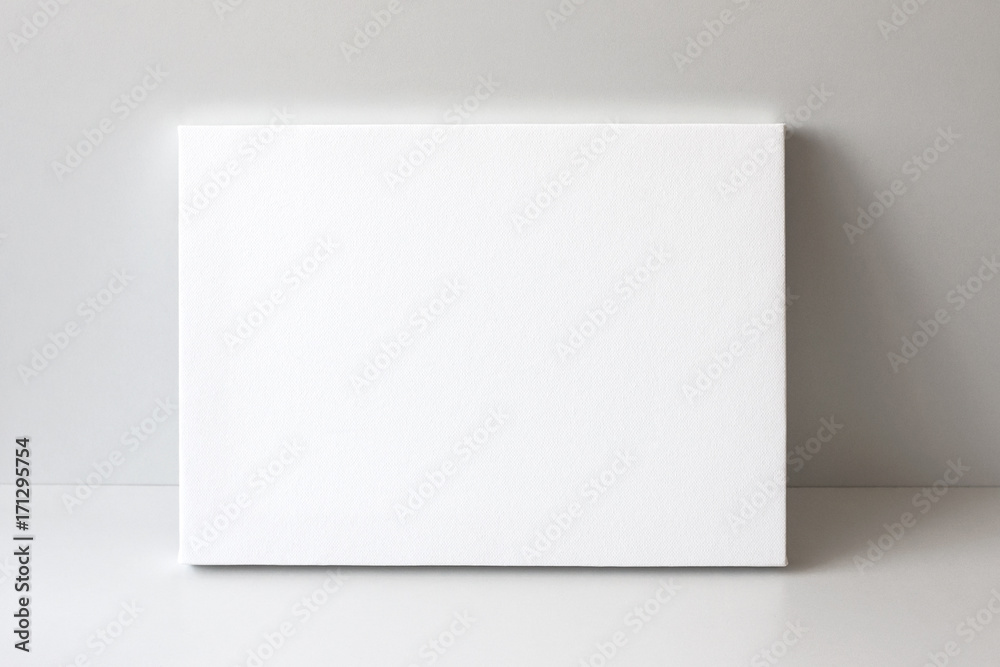 White empty canvas. Gray wall on background. Mock up poster frame, canvas template. - obrazy, fototapety, plakaty 