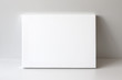 White empty canvas. Gray wall on background. Mock up poster frame, canvas template.