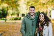 © Dirima - Lovely young couple in autumn at the park. Romantic man and woman in love outdoor in fall season.
