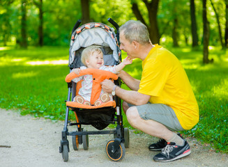 Grandfather and granddaughter and having fun outdoors