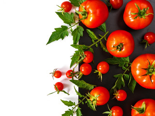 Fresh juicy tomatoes, cherry and leaves pattern and ornament on a black and white background with copy space flat view from above and place for text