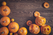 Halloween Pumpkins Over Wooden Background, Top View, Flat Lay With Copy Space For Text, Toned Image