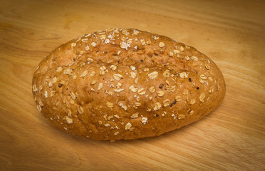 Fresh bread on wooden table.