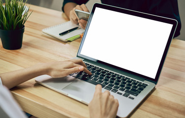 Fototapete - Women using a laptop on white screen. Take your screen to put on advertising.
