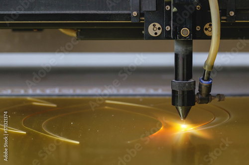 Fotografie, Obraz Laser cutting machine carving patterns on the plastic plate