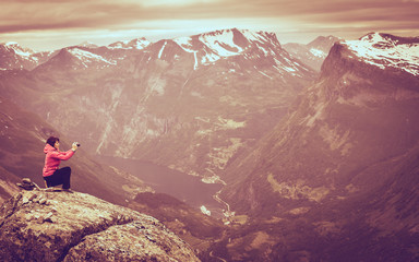 Poster - Tourist taking photo from Dalsnibba viewpoint Norway