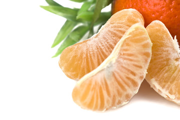 Wall Mural - Mandarin or Tangerine fruit with leaves on a white background