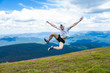 © Svetlana - Happy handsome man tourist jump high into the sky for joy during the walk in beautiful mountains