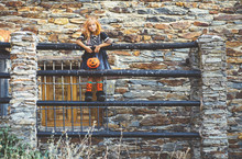 Kid In Costume Posing On Fence
