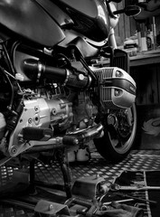 Wall Mural - CHONBURI, THAILAND- SEPTEMBER 10, 2017 :Tool on the platform and single cylinder head cover in motorcycle shop,black and white scene, black and white image