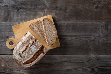 Sliced baked bread on cutting board