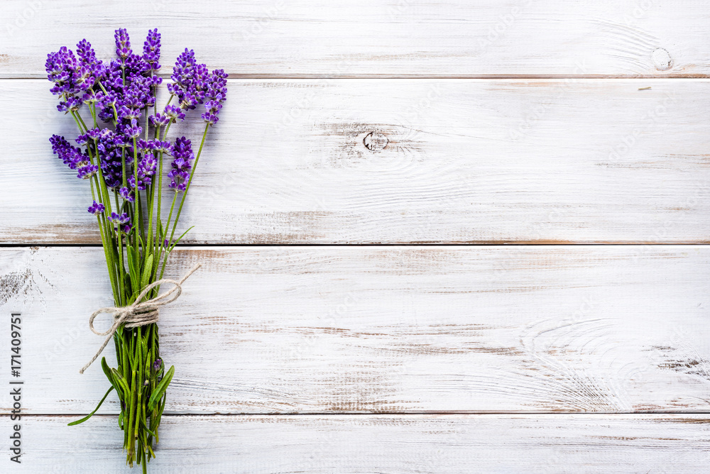 Fresh flowers of lavender bouquet, top view on white wooden background - obrazy, fototapety, plakaty 