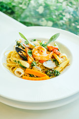 Wall Mural - Spicy seafood spaghetti or pasta in white plate