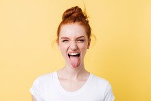 Funny Ginger Woman Showing Tongue And Looking At The Camera