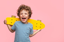 Cheerful Boy With Yellow Longboard