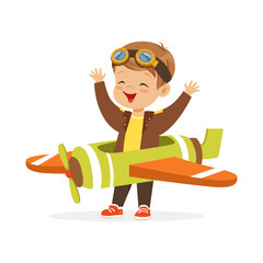 Poster - Cute little boy in pilot costume playing toy plane, kid dreaming of piloting the plane vector Illustration