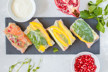 Canvas Print - raw spring rolls with vegetables on slate