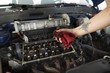© Westend61 - Woman's hand cleaning engine