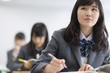 © amanaimages - High school students at class