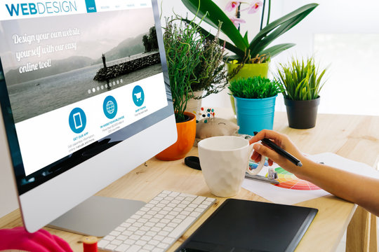 desk with computer and pen tablet web design