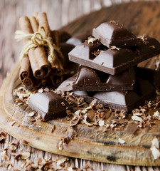 Wall Mural - pieces of chocolate with nuts and cinnamon