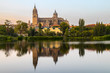 Salamanca Old and New Cathedrales reflected on Tormes River at sunset, Spain