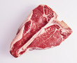 © exclusive-design - Prime cut tender raw t-bone steak for a BBQ