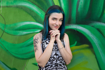 Wall Mural - Young beautiful girl against giant leaf (old public domain graffity)